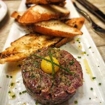 Cowboy Star Restaurant and Butcher Shop signature dishes Signature Steak Tartare
Pan Seared Salmon
"Sea Star" Platter